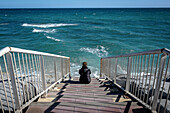 Stairs leading to a beach that has disappeared, in Vilassar de Mar, El Maresme, Catalonia, Spain