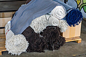 Rolls of woven wool textiles ready to be sewn into finished products. Hilandería Warmi, a weaving mill in Palpalá, Argentina.