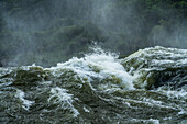 A detaied image of water going over the falls at Iguazu Falls National Park in Argentina. A UNESCO World Heritage Site.