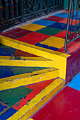 Colorfully-painted steps in a shopping arcade in a building in Caminito in La Boca, Buenos Aires, Argentina.