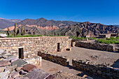 Partially reconstructed ruins in the Pucara of Tilcara, a pre-Hispanic archeological site near Tilcara, Humahuaca Valley, Argentina. This particular building was an Inca ceremonial structure.