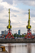 Retired gantry cranes for loading ships on display in the former docks of Puerto Madero, Buenos Aires, Argentina.