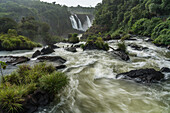 Iguazu Falls National Park in Brazil in the foreground and Argentina in the background. A UNESCO World Heritage Site. In the background are the Three Mustketeers Falls or Salto Tres Mosqueteros.