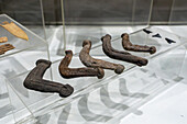 Carved wooden fasteners for securing loads on a llama's back. Pio Pablo Diaz Archeological Museum in Cachi, Argentina.