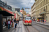 People waiting for the tram in Prague