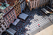 View of tourists, shops and restaurants from the tower of the Old Town Hall in Prague