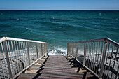 Stairs leading to a beach that has disappeared, in Vilassar de Mar, El Maresme, Catalonia, Spain