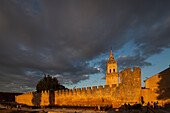 Burgo de Osma, Spain, Aug 12 2009, Golden light bathes the city walls and cathedral of El Burgo de Osma at sunset, highlighting the architectural beauty of this historic site.