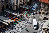 View of tourists, shops and restaurants from the tower of the Old Town Hall in Prague