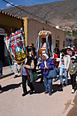 Parishioners carry a statue of the Virgin in a religious procession in the town of Tilcara, Argentina.