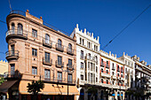 Seville, Spain, Sep 30 2009, Explore the stunning architecture of Seville\'s Avenida de la Constitucion featuring the Tourist Office and Seguros Santa Lucia.