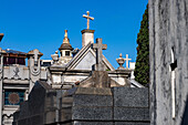 Crosses on elaborate tombs or mausoleums in the Recoleta Cemetery, Buenos Aires, Argentina.