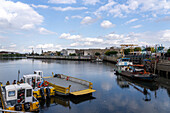 Workboats in La Vuelta de Rocha of the Matanza River at La Boca, Buenos Aires, Argentina.