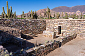 Partially reconstructed ruins in the Pucara of Tilcara, a pre-Hispanic archeological site near Tilcara, Humahuaca Valley, Argentina. This particular building was an Inca ceremonial structure.