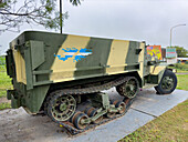 An army armored half-track personnel carrier in a memorial to the Malvinas War in San Jose de Metan, Argentina. A map of the Islas Malvinas is painted on the side.