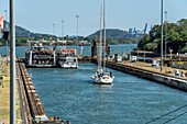 Ships passing through Miraflores Locks in the Panama Canal.