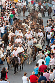 Almonte, Spain, June 26 2009, Riders and spectators gather in Almonte as wild mares are herded from Doñana marshlands during the annual Saca de las yeguas festival.