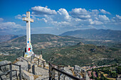 Majestic view of the landscape from the Cruz del Castillo de Santa Catalina in Jaen, Andalucia. Prominent cross overlooking vast mountains and beautiful countryside.