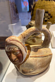 An Andean bichrome ceramic vessel with stirrup spout in the Dr. Eduardo Casanova Archeology Museum in Tilcara, Argentina.