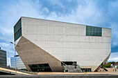 The Casa da Musica, designed by architect Rem Koolhaas, is a striking concert hall in Porto, Portugal, showcasing modern architecture and cultural significance.