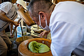 Making the traditional Daifuku in Nakatanidou shop, made of soft rice cake (mochi) fill with sweet bean paste, in Nara Japan.