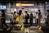 In the foreground, miniature reproductions of Fat Man and Little Boy bombs. Museum area for Little Boy. Exhibition inside the Hiroshima Peace Memorial Museum, Hiroshima, Japan