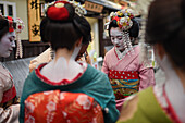 Group of women dressed as Maikos in the streets of Kyoto, Japan