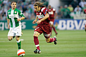 Seville, Spain, May 11 2008, Diego Capel dribbles the ball while being pursued by a Betis player in a local derby match in Seville on May 11, 2008.