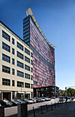 Berlin, Germany, July 27 2009, The striking GSW Building rises in Kreuzberg, Berlin, blending contemporary design with urban charm under a bright blue sky.