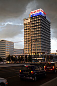 Berlin, Germany, July 24 2009, A sleek apartment on Karl-Marx-Allee captures evening light and dramatic clouds, showcasing Berlin\'s architectural beauty.