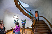 Barcelona, Spain, Sept 4 2008, Visitors admire the unique staircase and lobby of Casa Batlló, showcasing Gaudís architectural brilliance in Barcelona.