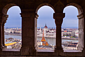 View of Parliament building, Chain Bridge and Danube River through old columns, Budapest, Hungary, Europe