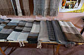 Hand-woven panchos for sale at a home weaving shop in Seclantas, Argentina in the Calchaqui Valley.