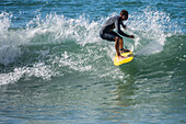 Surfers in Grande Plage beach of Biarritz, France