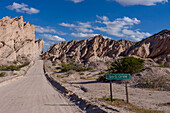 Route 40, an unpaved dirt road through the eroded landscape of the Angastaco Natural Monument in the Calchaqui Valley, Argentina.