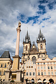 Marian Column (Mariánský sloup) in front on the Tyn Church (Týnský chrám) in Old Town Square (Staromestské námestí) in Prague