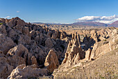 Route 40, an unpaved dirt road through the eroded landscape of the Angastaco Natural Monument in the Calchaqui Valley, Argentina.