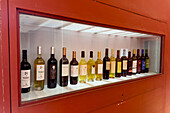 Local wines from the Calchaqui Valley on display in the shop in the Museo de la Vid y el Vino in Cafayate, Argentina.