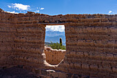 Adobe ruins at the Mirador de la Ventanita de los Valles Calchaquies between Cardones National Park & Payogasta, Argentina. The snow-capped Nevado de Cachi is framed by the doorway.