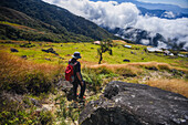 Young man hiking in the mountains of Sierra Nevada de Santa Marta, Colombia