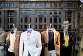 Elegant suits on display reflect the vibrant atmosphere of Regent Street in Westminster.