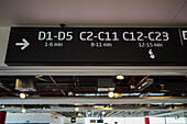 Animated sign indicates distance to departure gates in Prague Airport