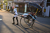 Rickshaw man at sunset in Kyoto, Japan