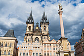 Marian Column (Mariánský sloup) in front on the Tyn Church (Týnský chrám) in Old Town Square (Staromestské námestí) in Prague