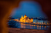 Illuminated Parliament building and Danube River it night, Budapest, Hungary, Europe