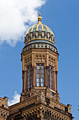 The ornate cupola and tower of the New Synagogue showcase Moorish design in the heart of Berlin\'s Mitte district.