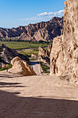 Route 40, an unpaved dirt road through the eroded landscape of the Angastaco Natural Monument in the Calchaqui Valley, Argentina.