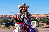 The rodeo queen's 1st Attendant poses on horseback before the Moab Junior Rodeo in Utah.