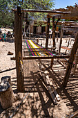 A wooden foot loom outside in a home weaving workshop in Seclantas, Argentina in the Calchaqui Valley.