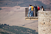 Ronda, Spain, Sep 22 2007, Tourists gaze at the breathtaking El Tajo gorge in Ronda, soaking in the stunning Andalusian landscape beneath a clear sky.